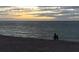 Evening stroll on the beach at dusk under a dramatic sky, creating a peaceful atmosphere at 721 Cadiz Rd, Venice, FL 34285