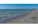 Expansive beach with gentle waves meeting the sandy shore on a clear day at 721 Cadiz Rd, Venice, FL 34285