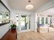Bright foyer featuring tile flooring, a glass front door and a lovely view to the outside at 721 Cadiz Rd, Venice, FL 34285
