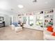 Inviting living room with built-in bookcases, a large window and comfortable seating at 721 Cadiz Rd, Venice, FL 34285