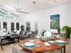 Bright living space with vaulted ceiling, tile floor, and seamless access to the backyard pool area at 721 Cadiz Rd, Venice, FL 34285