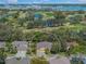 Aerial shot of property backing onto golf course, lakes and other upscale homes in a gated community at 7911 Kavanagh Ct, Sarasota, FL 34240