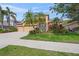 Charming single-Gathering home with a well-manicured lawn, decorative stone accents, and a three-car garage at 7911 Kavanagh Ct, Sarasota, FL 34240