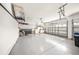 Spacious two car garage featuring a large open space and overhead storage at 7911 Kavanagh Ct, Sarasota, FL 34240