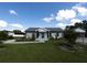 Attractive single-Gathering home with a well-maintained lawn, dark trim and a welcoming front entrance at 9716 28Th E St, Parrish, FL 34219