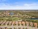 Aerial view of the homes and community, highlighting the golf course, lakes, and scenic surroundings at 13908 Messina Loop, Bradenton, FL 34211