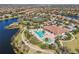 Aerial view of the community pool, boasting a tropical design and luxurious amenities at 13908 Messina Loop, Bradenton, FL 34211