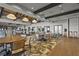 Expansive dining room with wood beams, pendant lighting, and scenic views at 13908 Messina Loop, Bradenton, FL 34211