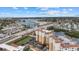 Stunning aerial view of a waterfront community with a bridge, marina, and nearby buildings at 147 Tampa E Ave # 702, Venice, FL 34285