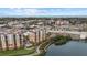 Stunning aerial view of a luxury condominium complex with pool and waterfront access, near the city and ocean at 147 Tampa E Ave # 702, Venice, FL 34285
