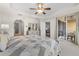 Primary bedroom featuring a tray ceiling and a balcony with a view at 147 Tampa E Ave # 702, Venice, FL 34285