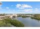 Picturesque water view of a bridge, marina, and tropical foliage at 147 Tampa E Ave # 702, Venice, FL 34285