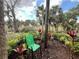 Landscaped backyard view of plants, trees, and pond area at 1515 Forrest Nelson Blvd # P107, Port Charlotte, FL 33952