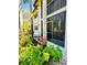 Condo exterior shows the lanai, trees, and a relaxing seating area surrounded by lush greenery at 1515 Forrest Nelson Blvd # P107, Port Charlotte, FL 33952