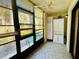 Enclosed lanai with tiled floor, window blinds, ceiling fan and ample sunlight at 1515 Forrest Nelson Blvd # P107, Port Charlotte, FL 33952