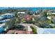 Breathtaking aerial view of coastal home with lush landscape and bay views at 1555 Flower Dr, Sarasota, FL 34239