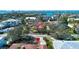 Wide angle, aerial view of a beautiful waterfront home with lush surroundings at 1555 Flower Dr, Sarasota, FL 34239