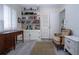 Bedroom features a bookshelf, desk and comfortable chair at 1555 Flower Dr, Sarasota, FL 34239
