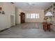 Bright living room with whitewashed fireplace, neutral tones and built-in shelving at 1555 Flower Dr, Sarasota, FL 34239
