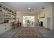 Bright living room with whitewashed fireplace, neutral tones and built-in shelving at 1555 Flower Dr, Sarasota, FL 34239