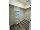 Walk-in closet with built-in shelving and a hanging rod at 18290 Grace Ave, Port Charlotte, FL 33948