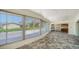 Enclosed lanai featuring tile flooring and access to the main house at 217 Giotto Dr, Nokomis, FL 34275