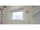 Bright bathroom featuring a shower with clear glass and white tile at 231 Hourglass Way # V5, Sarasota, FL 34242