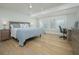 Serene bedroom with a comfortable bed, ceiling fan and ample natural light at 231 Hourglass Way # V5, Sarasota, FL 34242