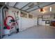 Organized garage with pegboard, storage cabinets, laundry appliances, and epoxy flooring at 231 Hourglass Way # V5, Sarasota, FL 34242