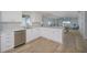 Bright, well-equipped kitchen featuring an open layout to the dining room and living areas at 231 Hourglass Way # V5, Sarasota, FL 34242
