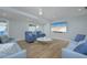 Bright living room with stylish decor and a wall-mounted TV at 231 Hourglass Way # V5, Sarasota, FL 34242