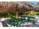 Enjoy outdoor dining at the picnic tables under this covered tiki hut at 231 Hourglass Way # V5, Sarasota, FL 34242