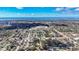 Scenic aerial view capturing the neighborhood, nearby water, and clear blue skies at 2900 Woodpine Ct, Sarasota, FL 34231