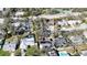 The home has a private pool, mature trees, and is near a community tennis court at 2900 Woodpine Ct, Sarasota, FL 34231