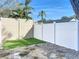 Fenced backyard with grass and gravel area, providing privacy and space for outdoor enjoyment at 2900 Woodpine Ct, Sarasota, FL 34231
