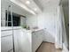 Clean bathroom with a sink, mirror, and shower with tub at 2900 Woodpine Ct, Sarasota, FL 34231