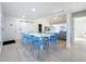 Bright and open dining area with seating for ten, seamlessly connected to living spaces at 2900 Woodpine Ct, Sarasota, FL 34231