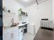 Efficient kitchenette features essential appliances, counter space, and storage for simplified cooking at 2900 Woodpine Ct, Sarasota, FL 34231