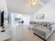 Bright living room with comfortable seating, view of the water, and modern decor at 2900 Woodpine Ct, Sarasota, FL 34231