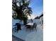 Charming outdoor patio features a dining table with chairs and a grill, ideal for outdoor gatherings at 2900 Woodpine Ct, Sarasota, FL 34231