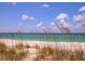 Beautiful beach with turquoise waters and dunes at 430 Kumquat Ct # 306, Sarasota, FL 34236