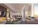 Bright, open-concept living space featuring modern furnishings, fireplace, and floor-to-ceiling windows at 430 Kumquat Ct # 306, Sarasota, FL 34236