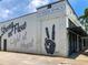 Trendy Yoga Shack featuring artistic murals, promoting wellness and community in a stylish urban setting at 430 Kumquat Ct # 406, Sarasota, FL 34236