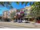 Charming buildings with colorful facades, balconies and street parking in a quaint neighborhood setting at 430 Kumquat Ct # 406, Sarasota, FL 34236