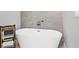 Bathroom features a freestanding soaking tub with modern fixtures and a tiled accent wall at 4529 Crowell Ln, North Port, FL 34288