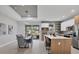 An open kitchen with a large island, modern appliances, recessed lighting, and access to the pool area at 4529 Crowell Ln, North Port, FL 34288