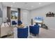 A bright living room with gray walls, recessed lights, modern furniture, and lots of natural light at 4529 Crowell Ln, North Port, FL 34288
