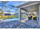 Backyard oasis with a beautiful pool, a screened lanai, and stylish stone patio for outdoor enjoyment at 4529 Crowell Ln, North Port, FL 34288