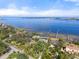 Expansive waterfront property showcasing manicured lawns and lush trees with serene bay views at 4620 Riverview Blvd, Bradenton, FL 34209
