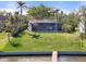 Waterfront home with screened in patio and large yard offering access to both land and water activities at 4620 Riverview Blvd, Bradenton, FL 34209